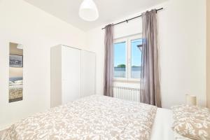 Ένα ή περισσότερα κρεβάτια σε δωμάτιο στο Belvedere apartments