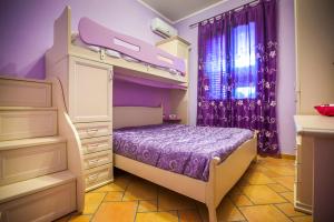 A bed or beds in a room at Profumo di Zagara