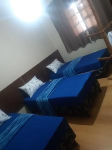 Postel nebo postele na pokoji v ubytování Cascais Quartos & Suítes