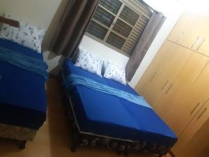 Postel nebo postele na pokoji v ubytování Cascais Quartos & Suítes