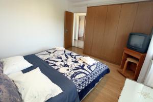 Voodi või voodid majutusasutuse Portorož Apartments MG toas