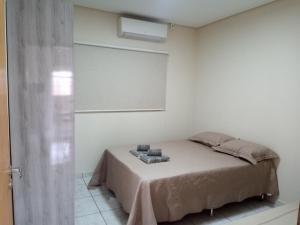 A bed or beds in a room at Residencial Joed 4