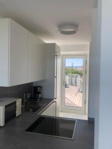 Zdjęcie z galerii obiektu Augartenblick Penthauscombo 14/15/16 - Blick zum Riesenrad w Wiedniu