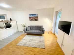 Istumisnurk majutusasutuses Ferienwohnung Blickfang - Modernes Apartment direkt in der Altstadt von Erfurt mit Balkon - beste Lage und Aussicht