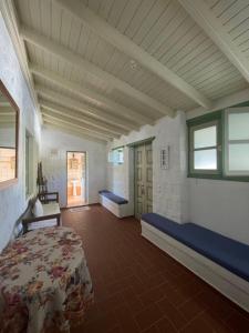 a large room with a bed and a window at Patmos Villas in Grikos
