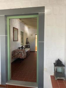 a view of a room with a bed through a doorway at Patmos Villas in Grikos