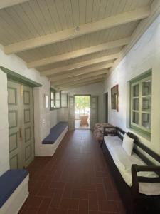 a hallway with two beds in a room at Patmos Villas in Grikos