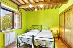Postel nebo postele na pokoji v ubytování Agriturismo La Fattoria