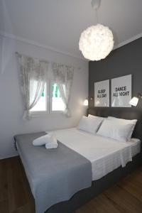 Ліжко або ліжка в номері Bianca Suites
