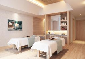 a spa room with two tables and a mirror at Holiday Inn Resort Ho Tram Beach by IHG in Ho Tram