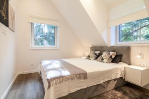 Posteľ alebo postele v izbe v ubytovaní Karklė Living Apartments, By Cohost