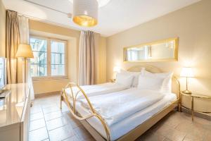 Кровать или кровати в номере Altstadt Hotel Magic Luzern