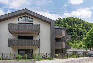 a building with balconies on the side of it at Apartments Traunkai Bad Ischl in Bad Ischl