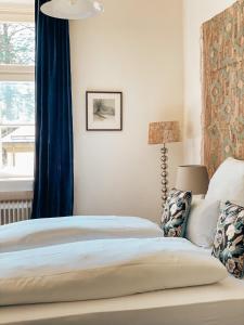 Säng eller sängar i ett rum på Pop-Up Lodge Wildbad Kreuth
