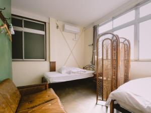 Кровать или кровати в номере Guesthouse Hitoyado