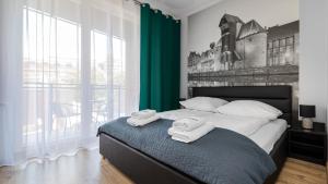 Postel nebo postele na pokoji v ubytování Maya's Flats & Resorts 36 - Walowa 25