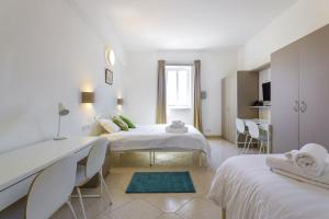 Letto o letti in una camera di Ta Gianni Guest House