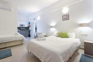 Letto o letti in una camera di Ta Gianni Guest House