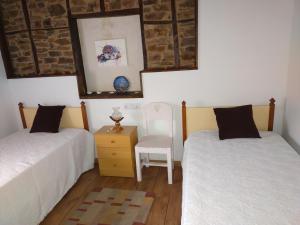 Posteľ alebo postele v izbe v ubytovaní La casita de la señora María