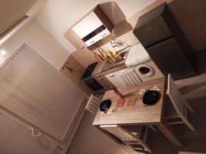 Η κουζίνα ή μικρή κουζίνα στο Apartman Todorovic +9 φωτογραφίες