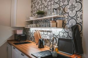 Kuchyň nebo kuchyňský kout v ubytování Apartmány Pulgary