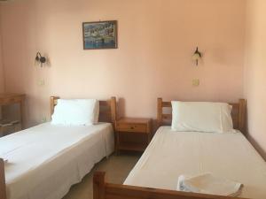A bed or beds in a room at Nikolas Apartments Kalami bay