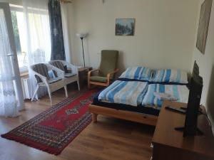 Łóżko lub łóżka w pokoju w obiekcie Pokoje i Apartamenty u Anny