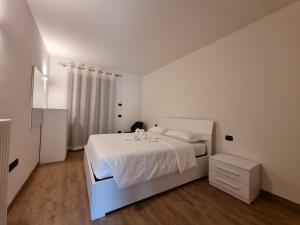 Postel nebo postele na pokoji v ubytování Tenno Appartamenti Garda Lake