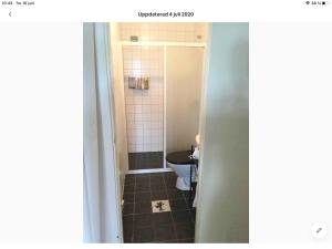 a bathroom with a toilet and a sink at Stråvalla Hulegården in Stråvalla