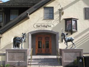 a statue of a horse in front of a building at Sun Valley Resort in Sun Valley