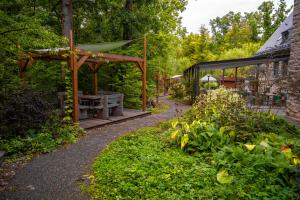 a garden with a table and a pavilion at Cavallestro Deluxe in Kitzingen