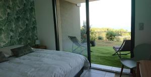 Postel nebo postele na pokoji v ubytování Magnifique T3 DUPLEX Vue Panoramique Golfe Ajaccio