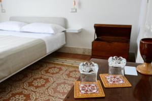 Posteľ alebo postele v izbe v ubytovaní DOMUS ALERIA Deluxe Rooms