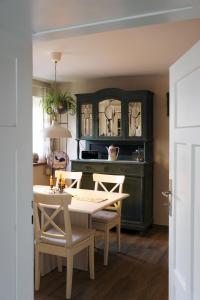 a dining room with a table and chairs at Ferienhaus Eifel 1851 in Gipperath