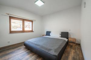 Säng eller sängar i ett rum på Pohoda Salaš u Velehradu-2 apartmany