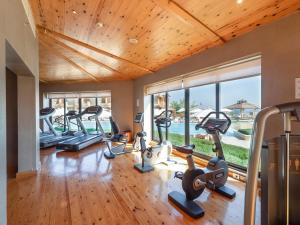 a gym with treadmills and exercise equipment in a house at The Cascades Golf Resort, Spa & Thalasso in Hurghada