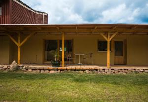 a porch of a house with a table and chairs at Aparthotel & Seminarhaus Wolkentor in Halle an der Saale