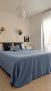Posteľ alebo postele v izbe v ubytovaní Apartamento céntrico cerca de la playa