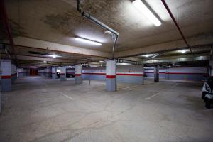 an empty parking lot in a parking garage at Charming apartment near beach in Sveti Stefan