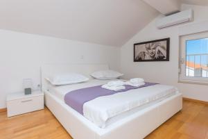 Posteľ alebo postele v izbe v ubytovaní Apartman Marla