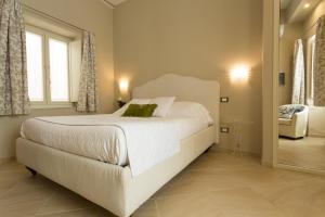 Postel nebo postele na pokoji v ubytování Maecò Ortigia B&B