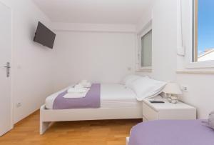Posteľ alebo postele v izbe v ubytovaní Apartman Marla