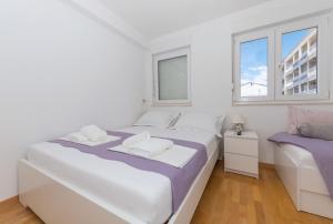 Posteľ alebo postele v izbe v ubytovaní Apartman Marla