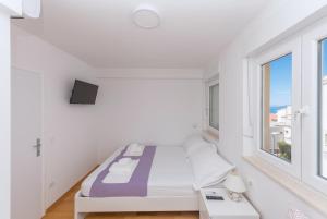 Posteľ alebo postele v izbe v ubytovaní Apartman Marla