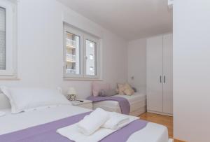 Posteľ alebo postele v izbe v ubytovaní Apartman Marla