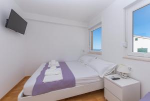 Posteľ alebo postele v izbe v ubytovaní Apartman Marla