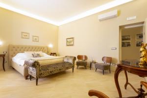 Postel nebo postele na pokoji v ubytování Maecò Ortigia B&B