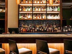 a bar with a lot of bottles of alcohol at Mount Lofty House in Adelaide