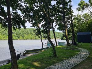 two boats parked on the shore of a lake at Cabana Bahna in Iloviţa +10 photos