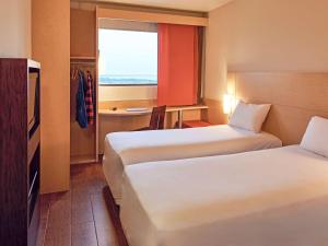 Cama ou camas em um quarto em Ibis Cancun Centro
